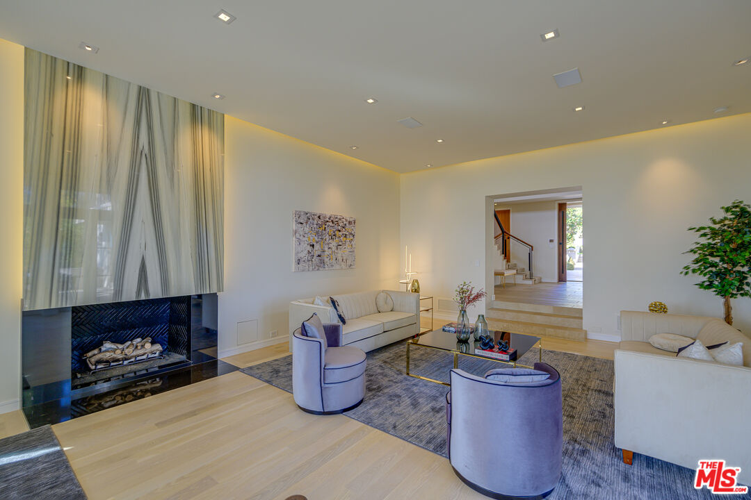 1235 Tower Road Beverly Hills, CA 90210 - Photo 10 of 31 a living room with furniture and a fireplace