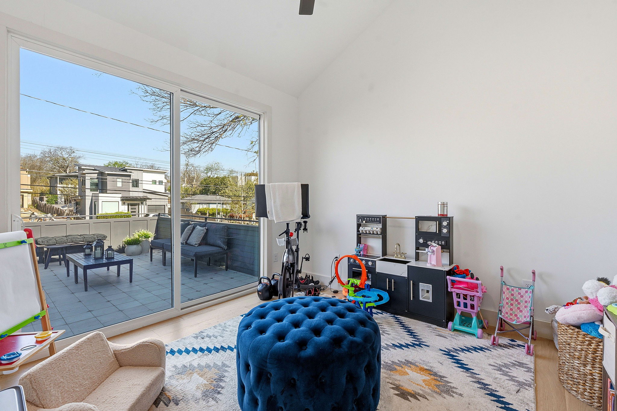 4313 Jinx Avenue, Unit 1 Austin, TX 78704 - Photo 12 of 40 Playroom featuring lofted ceiling and ceiling fan
