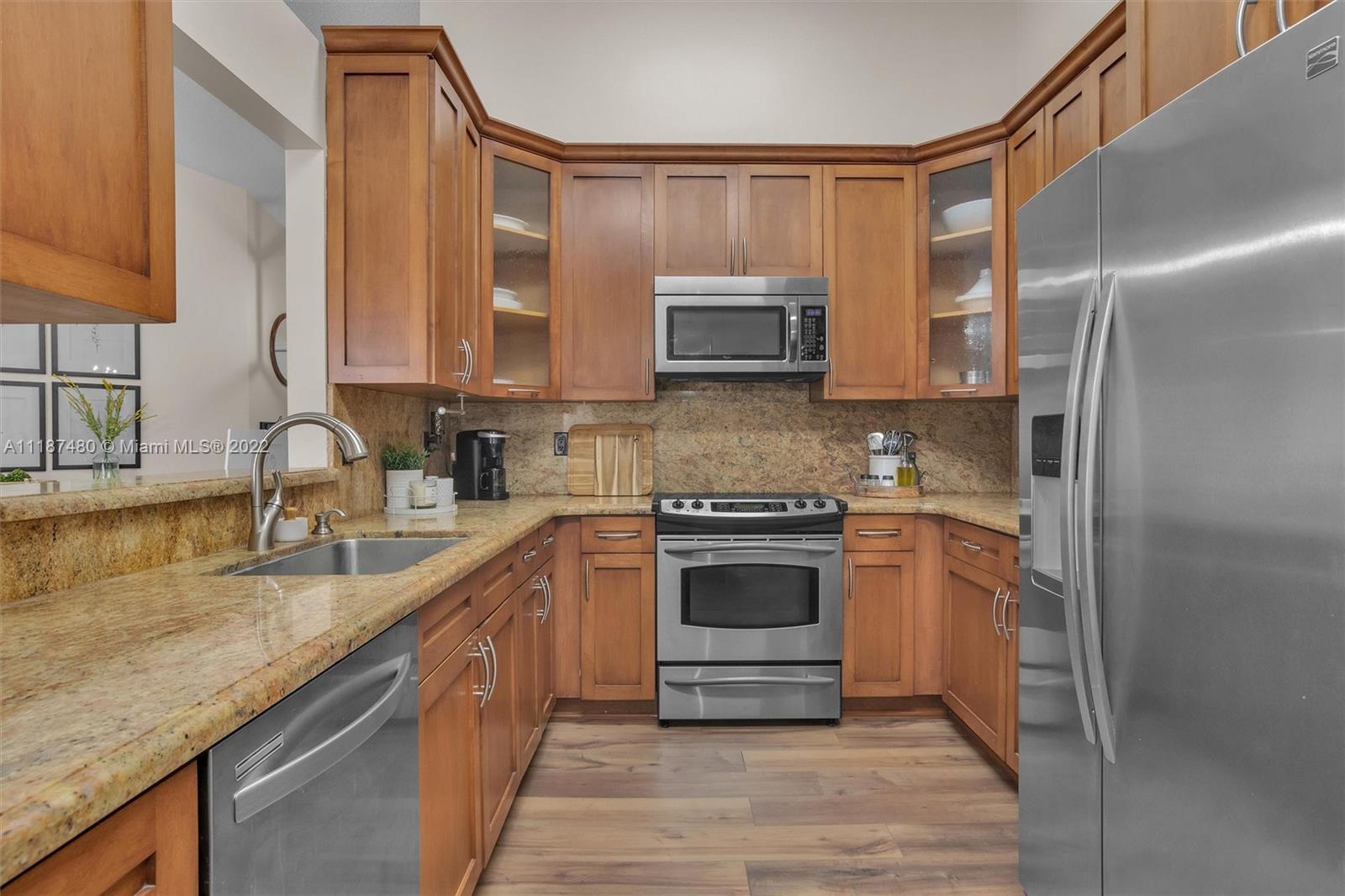 Jacaranda Plantation, FL 33324 - Photo 11 of 43 a kitchen with a sink stove and refrigerator