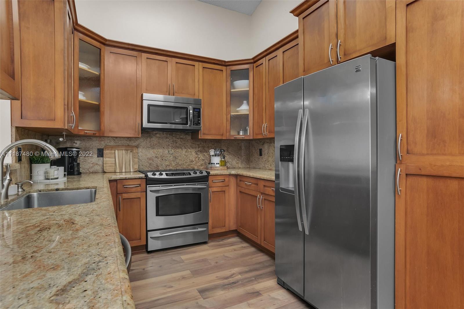 Jacaranda Plantation, FL 33324 - Photo 13 of 43 a kitchen with a refrigerator sink and microwave