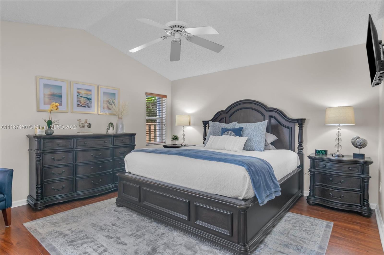 Jacaranda Plantation, FL 33324 - Photo 17 of 43 a bedroom with a bed and a dresser