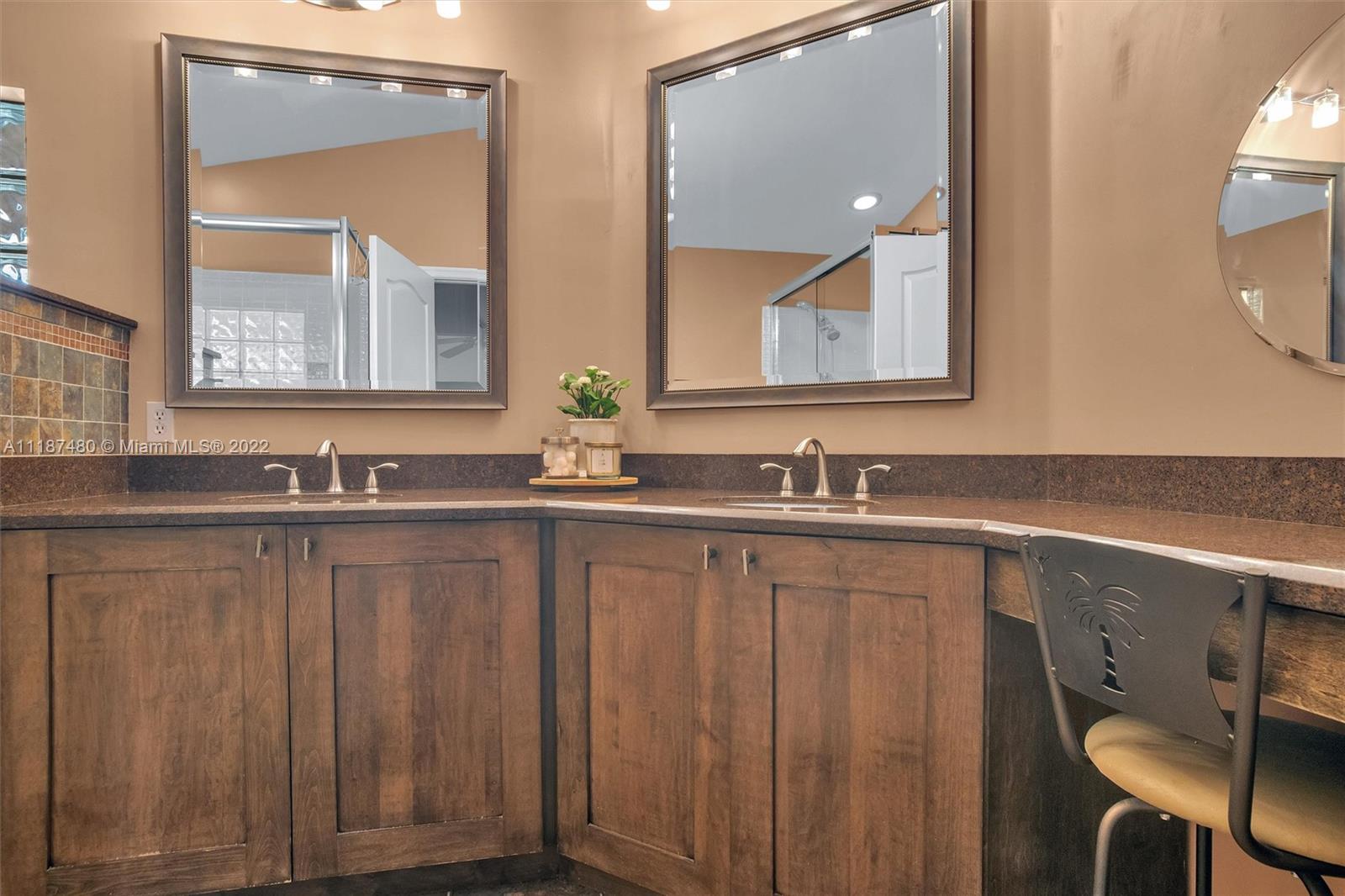 Jacaranda Plantation, FL 33324 - Photo 21 of 43 a bathroom with a double vanity sink and a mirror