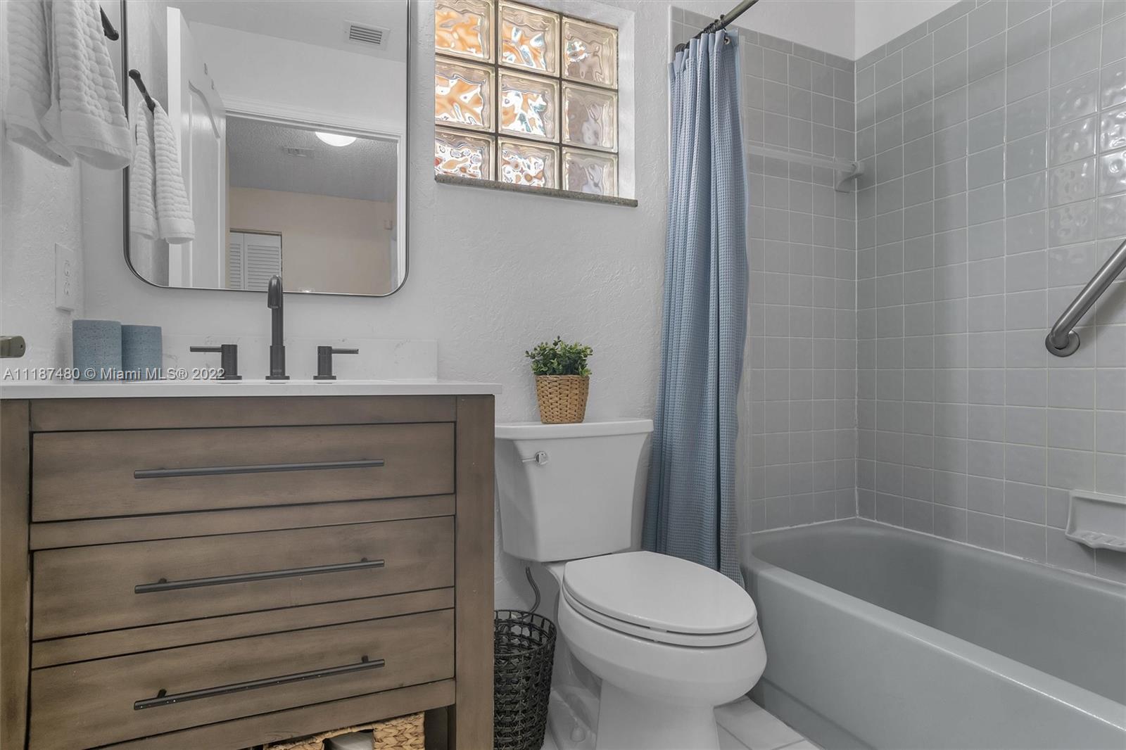 Jacaranda Plantation, FL 33324 - Photo 25 of 43 a bathroom with a sink a toilet and shower