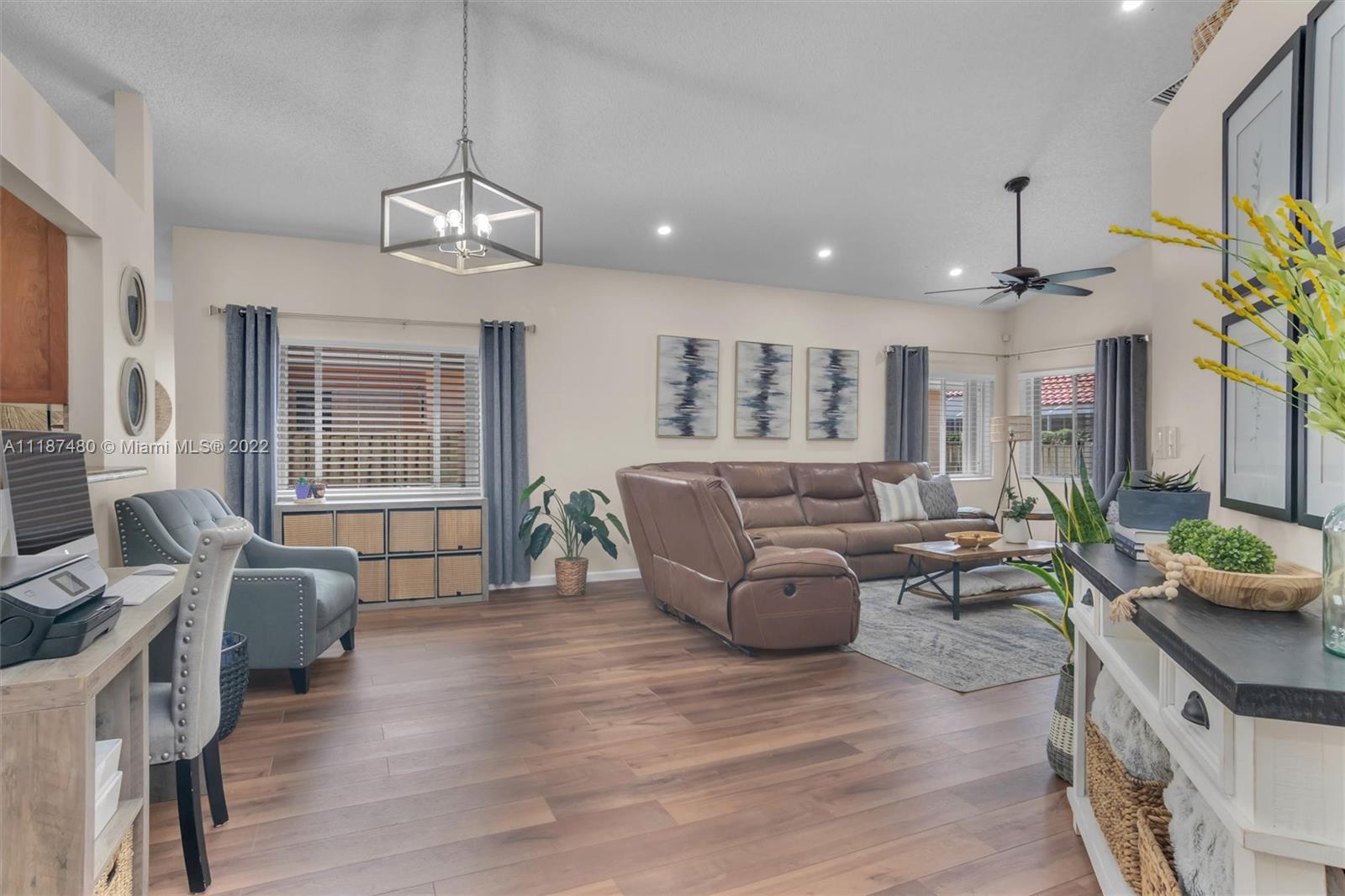 Jacaranda Plantation, FL 33324 - Photo 5 of 43 a living room with furniture kitchen and a chandelier