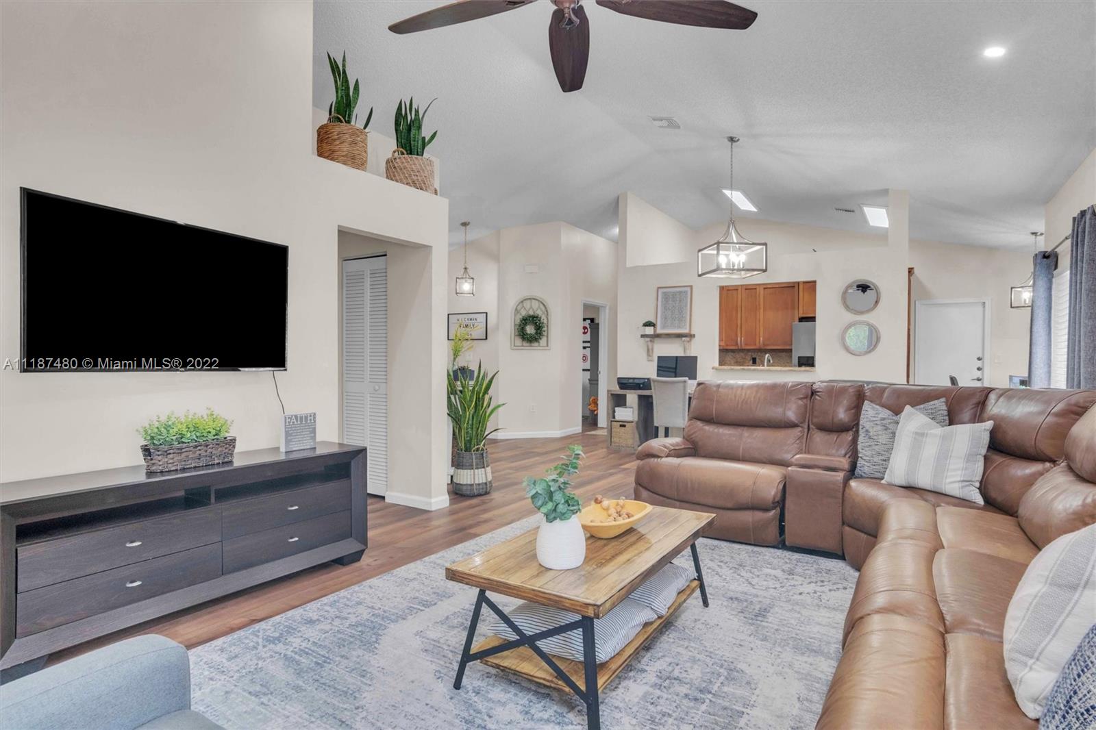 Jacaranda Plantation, FL 33324 - Photo 9 of 43 a living room with furniture and a flat screen tv