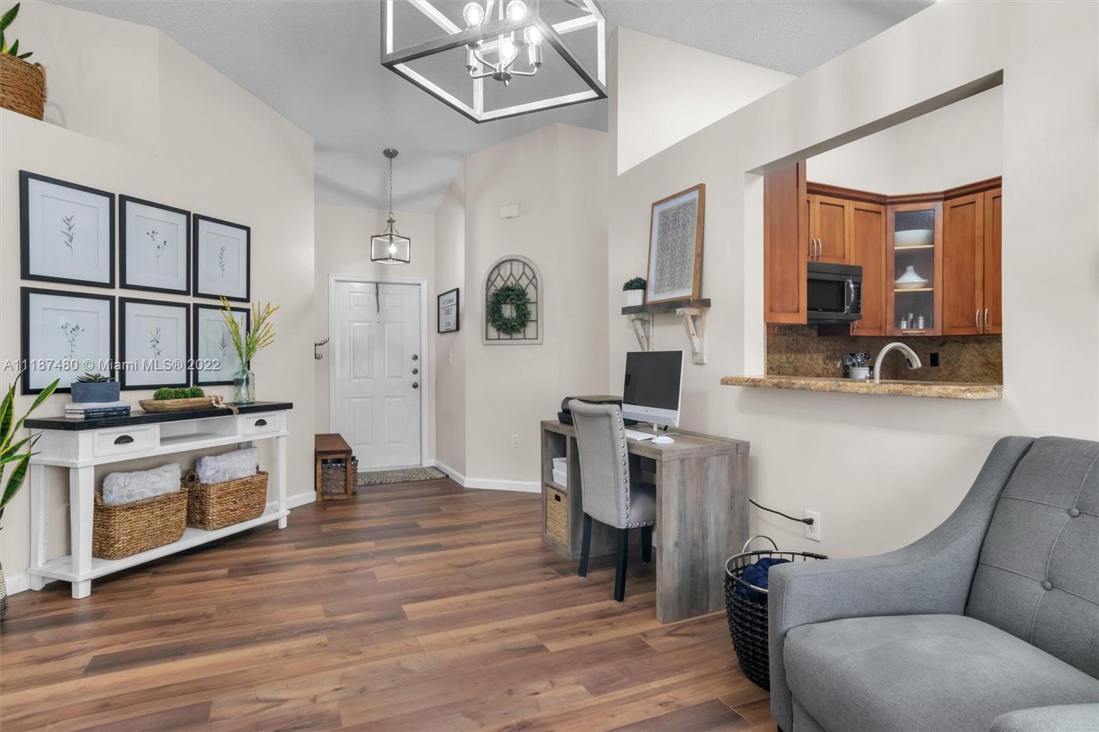 Jacaranda Plantation, FL 33324 - Photo 10 of 43 a living room with stainless steel appliances kitchen island granite countertop furniture and a kitchen view