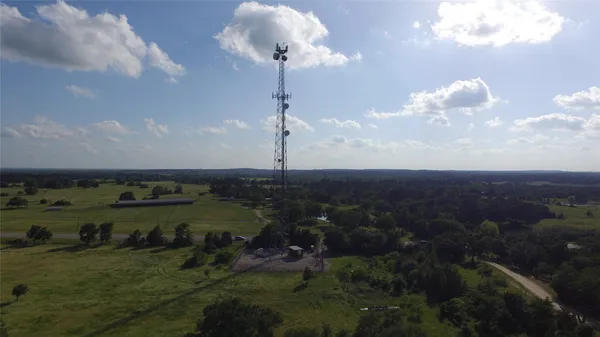 a view of a lake in middle of forest