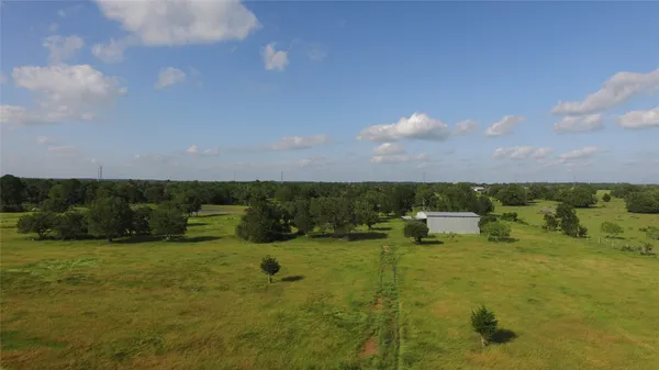 a view of a lake with houses in the back
