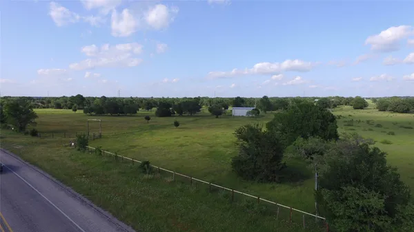 a view of a lake with a yard