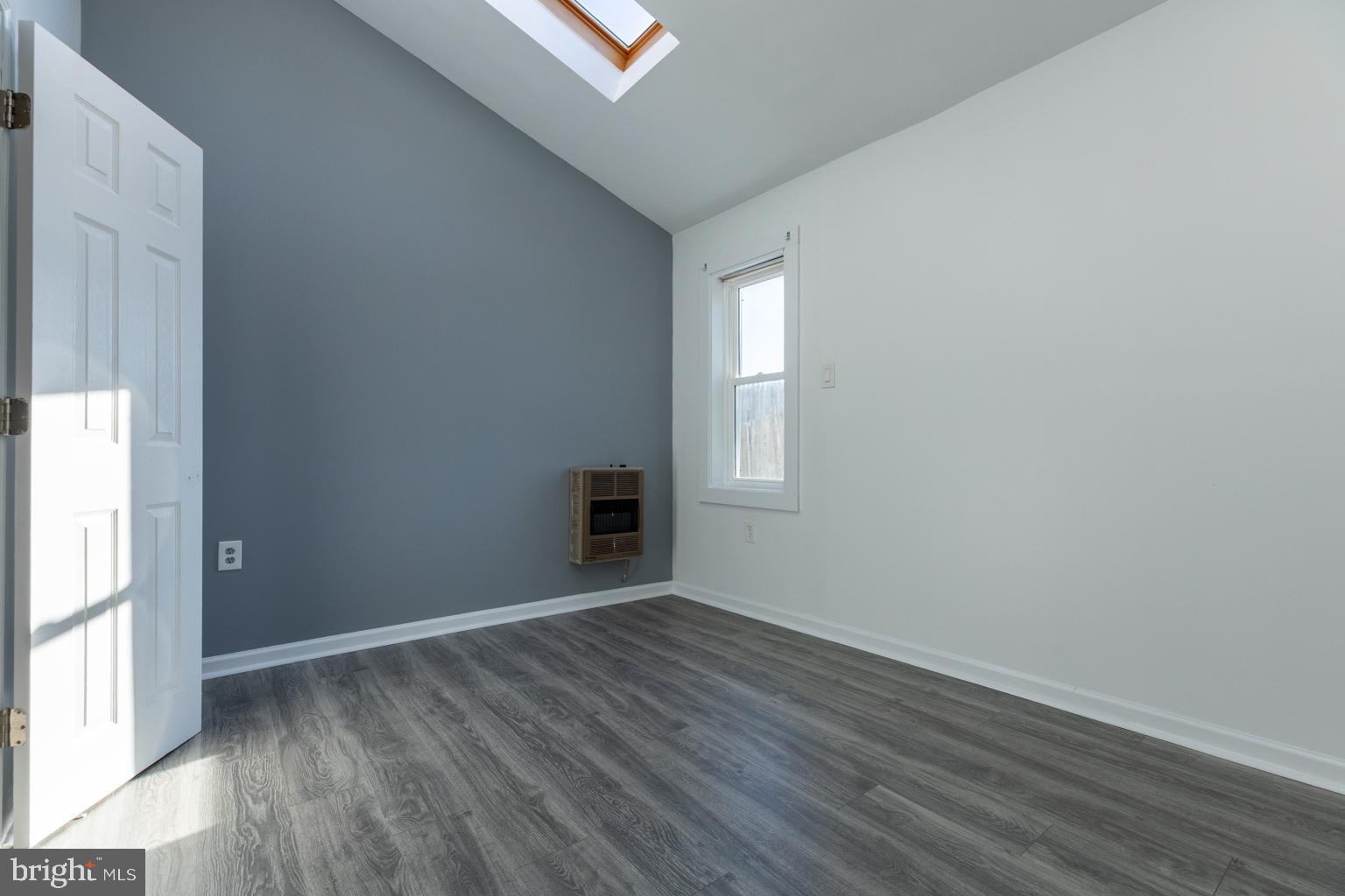 5 Farragut Court Willingboro, NJ 08046 - Photo 11 of 51 an empty room with wooden floor and windows