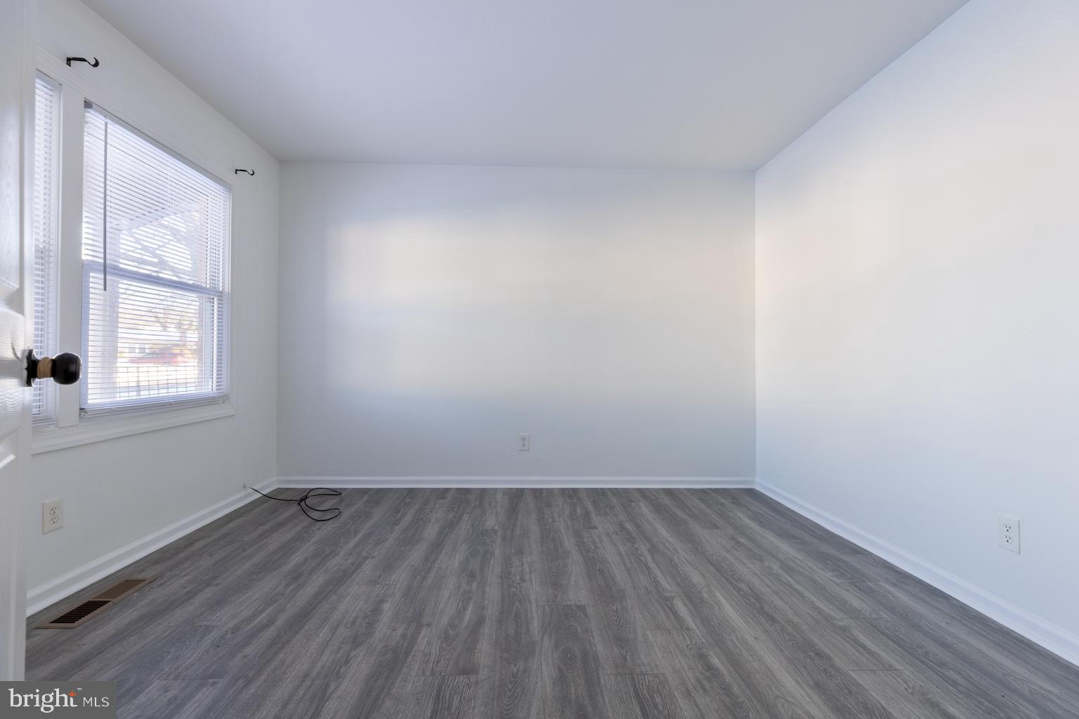 5 Farragut Court Willingboro, NJ 08046 - Photo 2 of 51 an empty room with wooden floor and windows