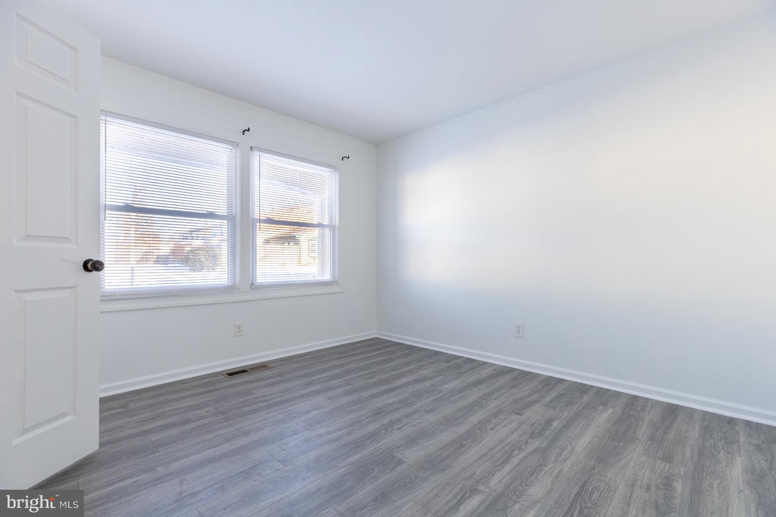 5 Farragut Court Willingboro, NJ 08046 - Photo 3 of 51 wooden floor in an empty room with a window