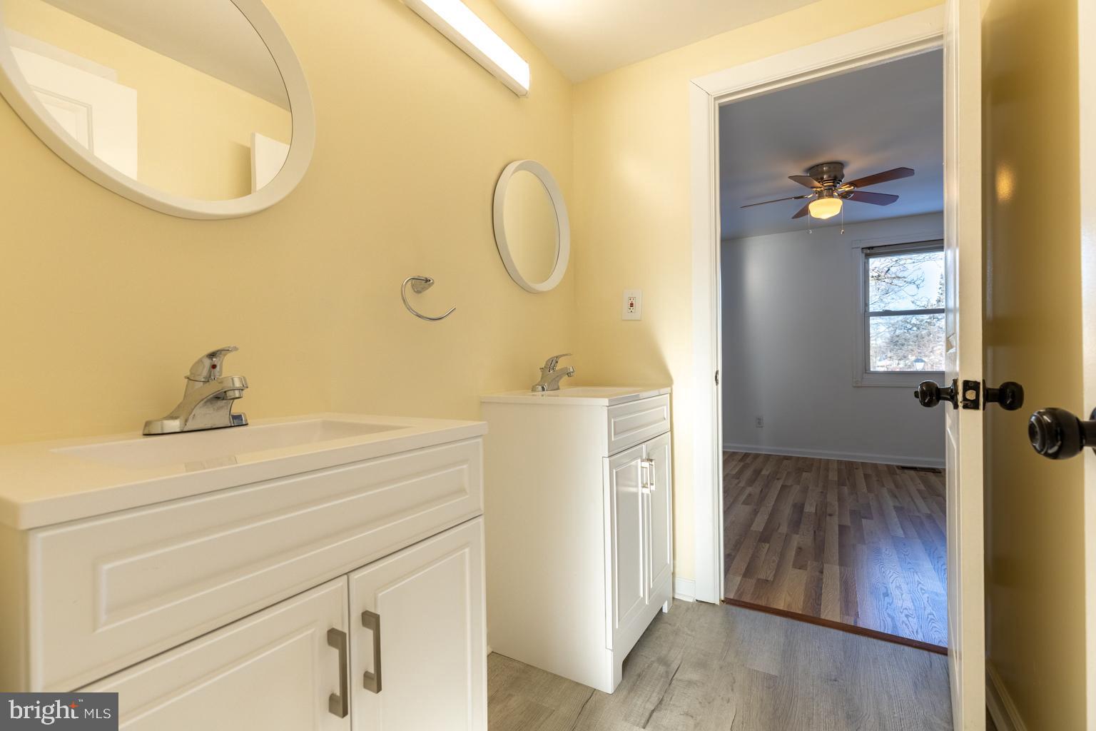 5 Farragut Court Willingboro, NJ 08046 - Photo 31 of 51 a bathroom with a sink a mirror and vanity