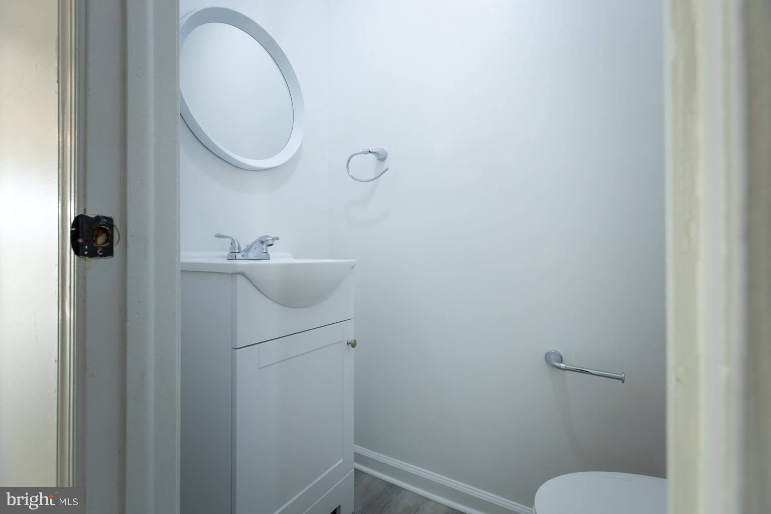 5 Farragut Court Willingboro, NJ 08046 - Photo 40 of 51 a bathroom with a sink a toilet and a mirror