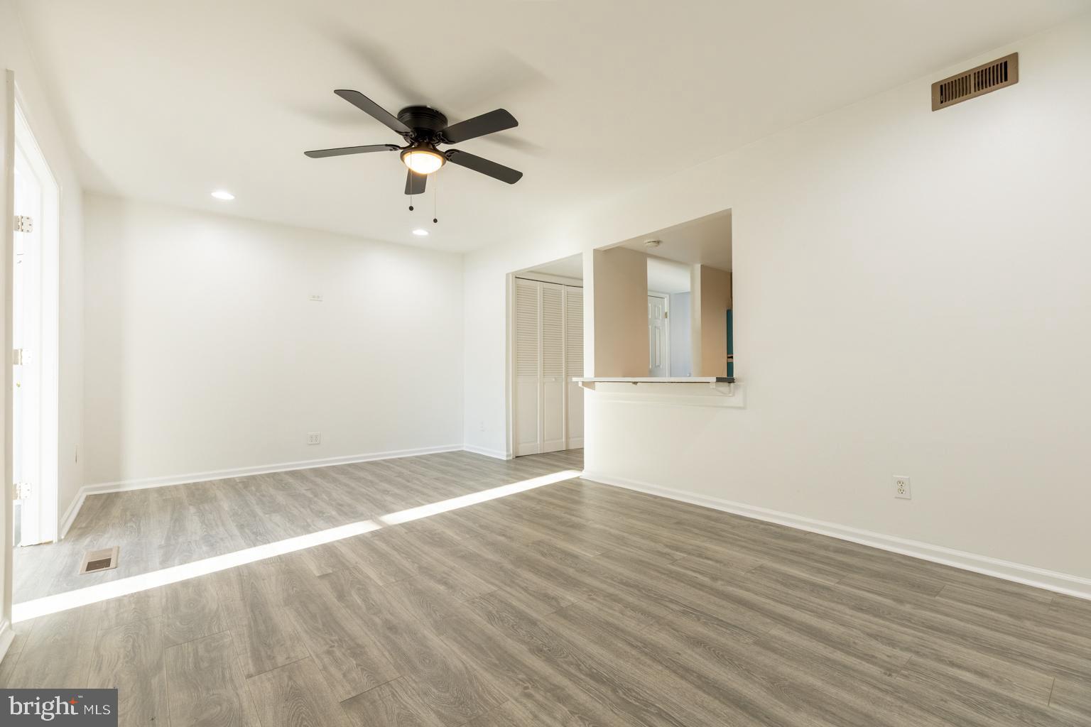 5 Farragut Court Willingboro, NJ 08046 - Photo 8 of 51 wooden floor in an empty room with a window