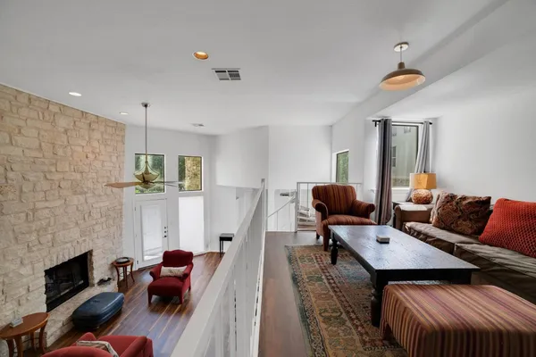a living room with furniture and a fireplace