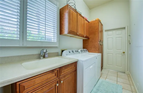 a kitchen that has a lot of cabinets in it