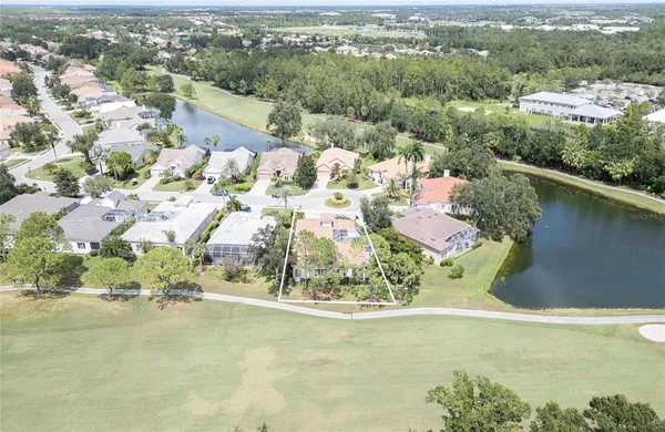 an aerial view of houses with outdoor space