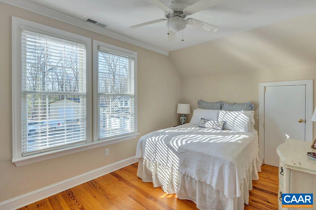 7920 Chestnut Grove Road Esmont, VA 22937 - Photo 14 of 34 a bedroom with a bed and a window