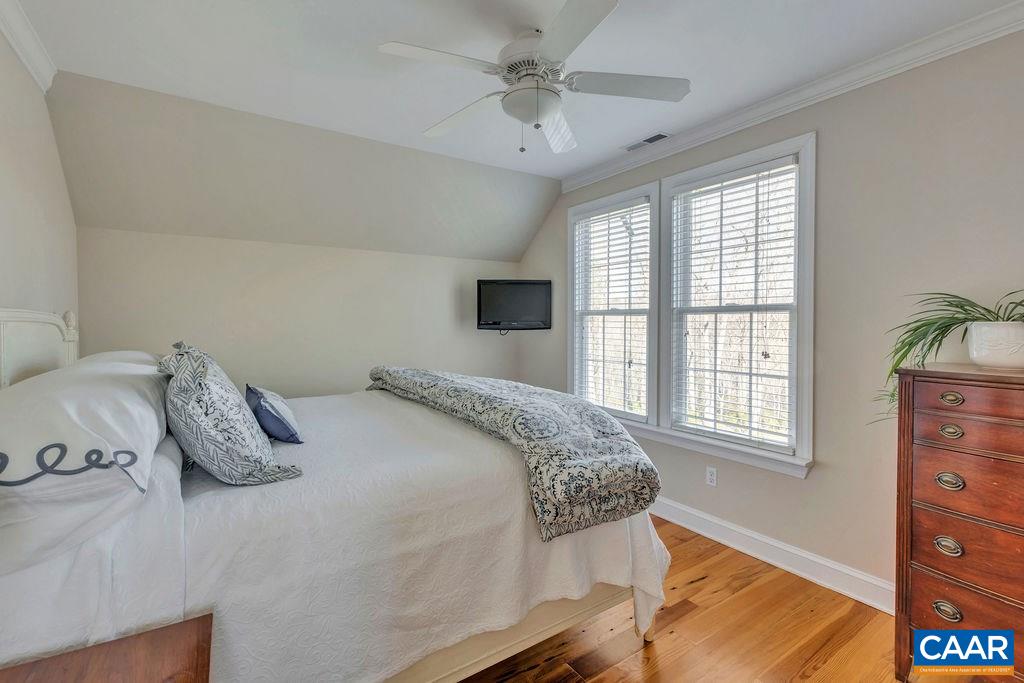 7920 Chestnut Grove Road Esmont, VA 22937 - Photo 16 of 34 a bedroom with a bed and wooden floor