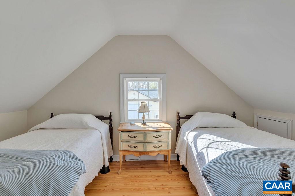 7920 Chestnut Grove Road Esmont, VA 22937 - Photo 19 of 34 a bedroom with a bed and a window