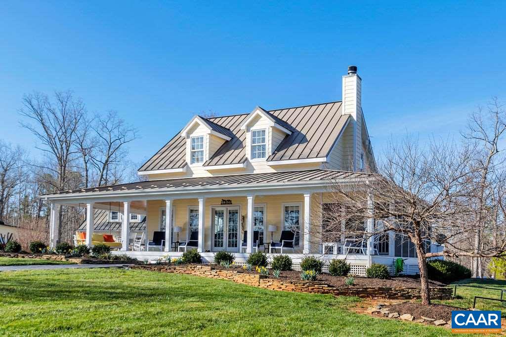 7920 Chestnut Grove Road Esmont, VA 22937 - Photo 21 of 34 a front view of a house with garden and trees