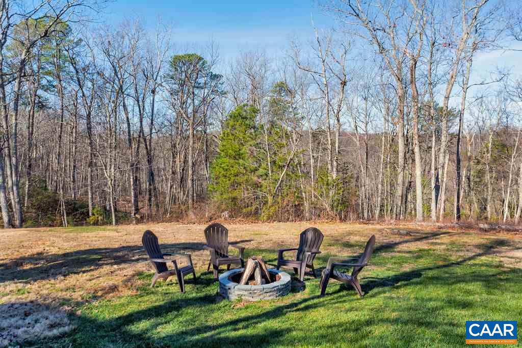 7920 Chestnut Grove Road Esmont, VA 22937 - Photo 23 of 34 a backyard of a house with table and chairs