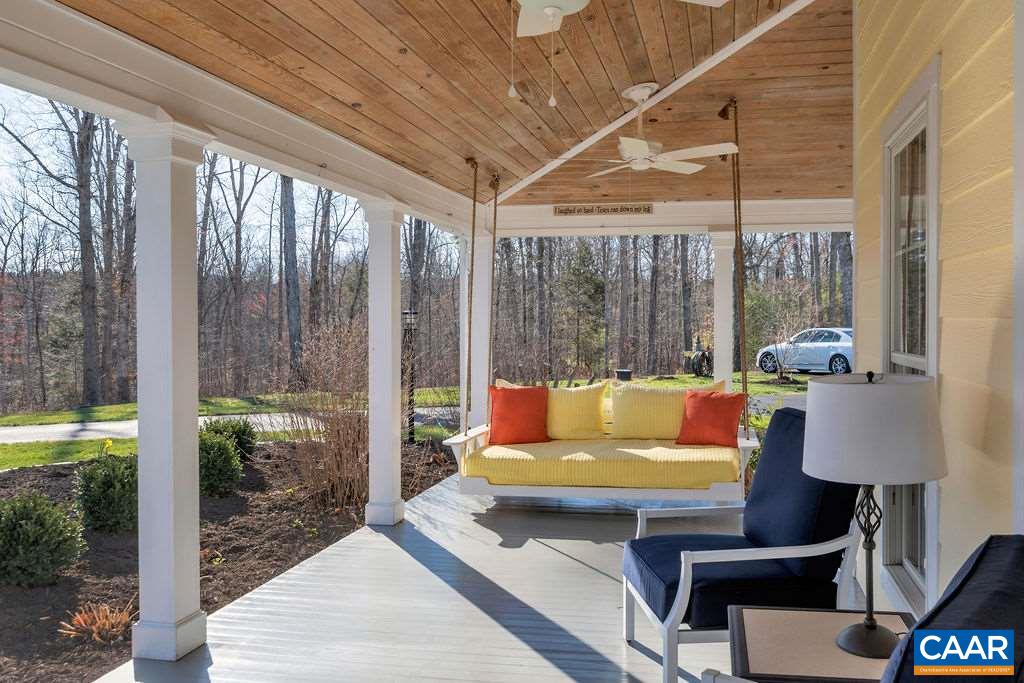 7920 Chestnut Grove Road Esmont, VA 22937 - Photo 26 of 34 a outdoor sitting area with couch and wooden floor
