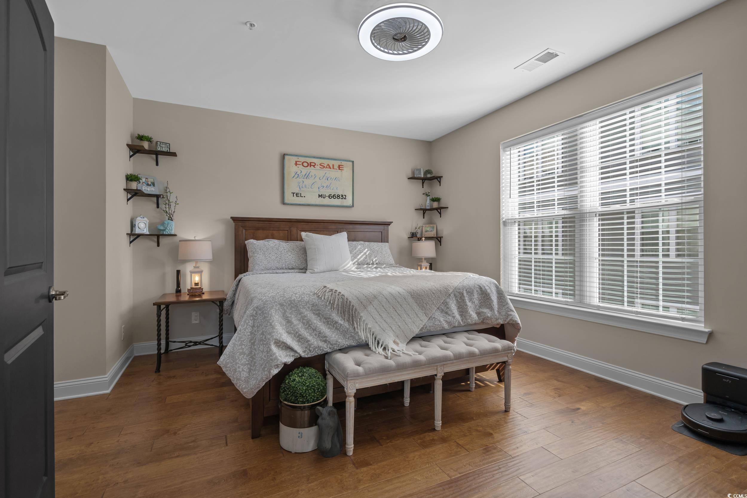 142 Ella Kinley Circle, Unit 304 Myrtle Beach, SC 29588 - Photo 23 of 38 Bedroom with wood-type flooring