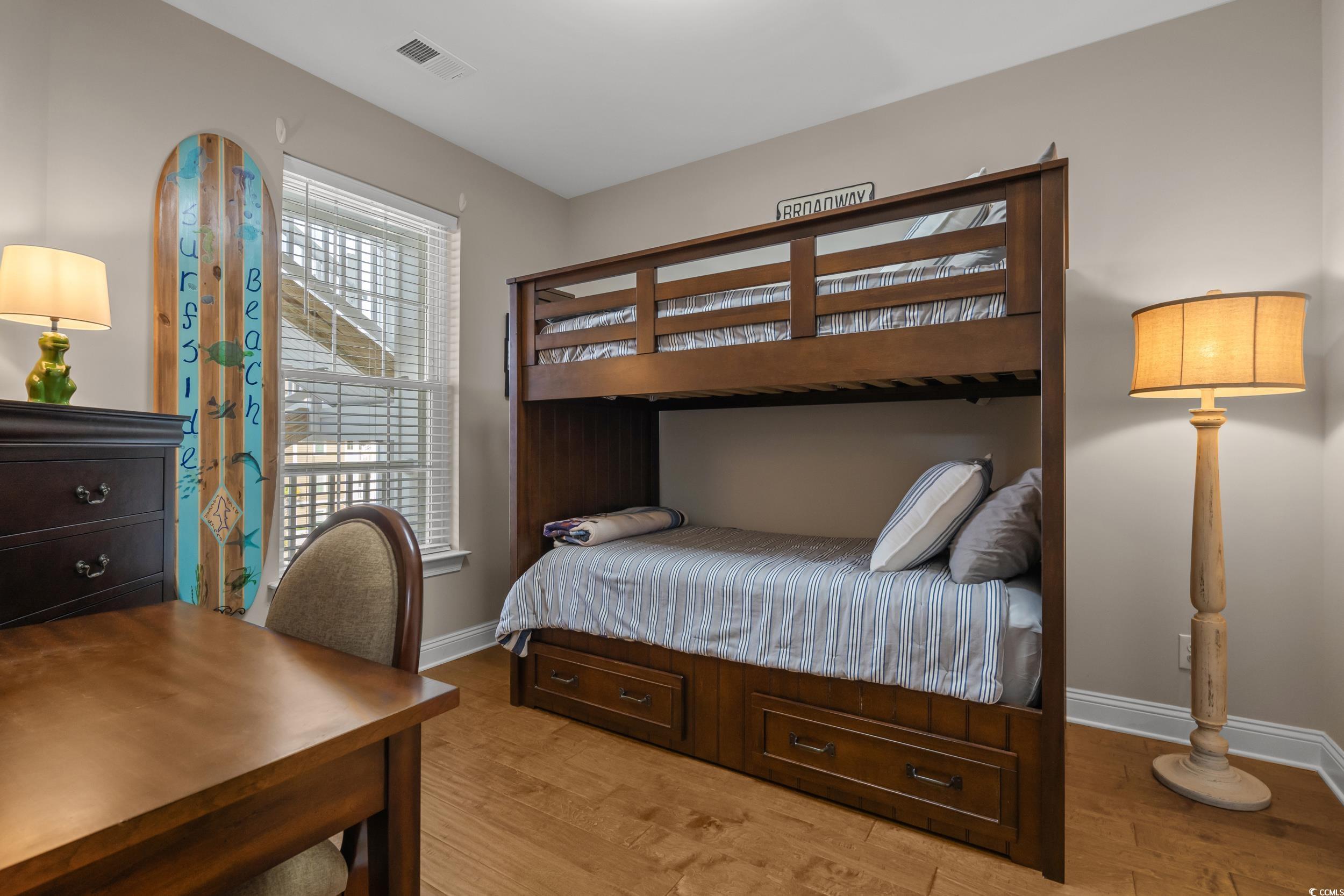 142 Ella Kinley Circle, Unit 304 Myrtle Beach, SC 29588 - Photo 29 of 38 Bedroom with light wood-style floors