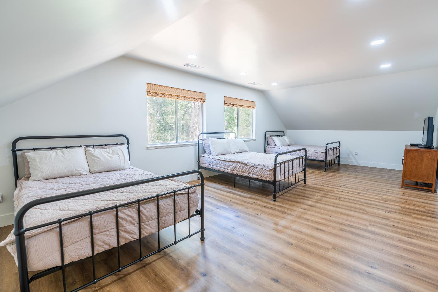 28960 Snowhite Ridge Drive Long Barn, CA 95335 - Photo 14 of 15 a bedroom with two beds and wooden floor