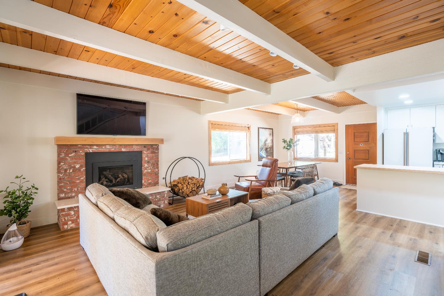 28960 Snowhite Ridge Drive Long Barn, CA 95335 - Photo 3 of 15 a living room with furniture a fireplace and wooden floor