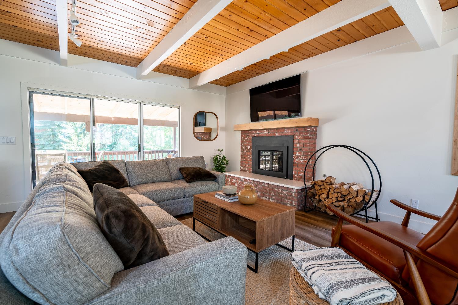 28960 Snowhite Ridge Drive Long Barn, CA 95335 - Photo 5 of 15 a living room with furniture a fireplace and a flat screen tv