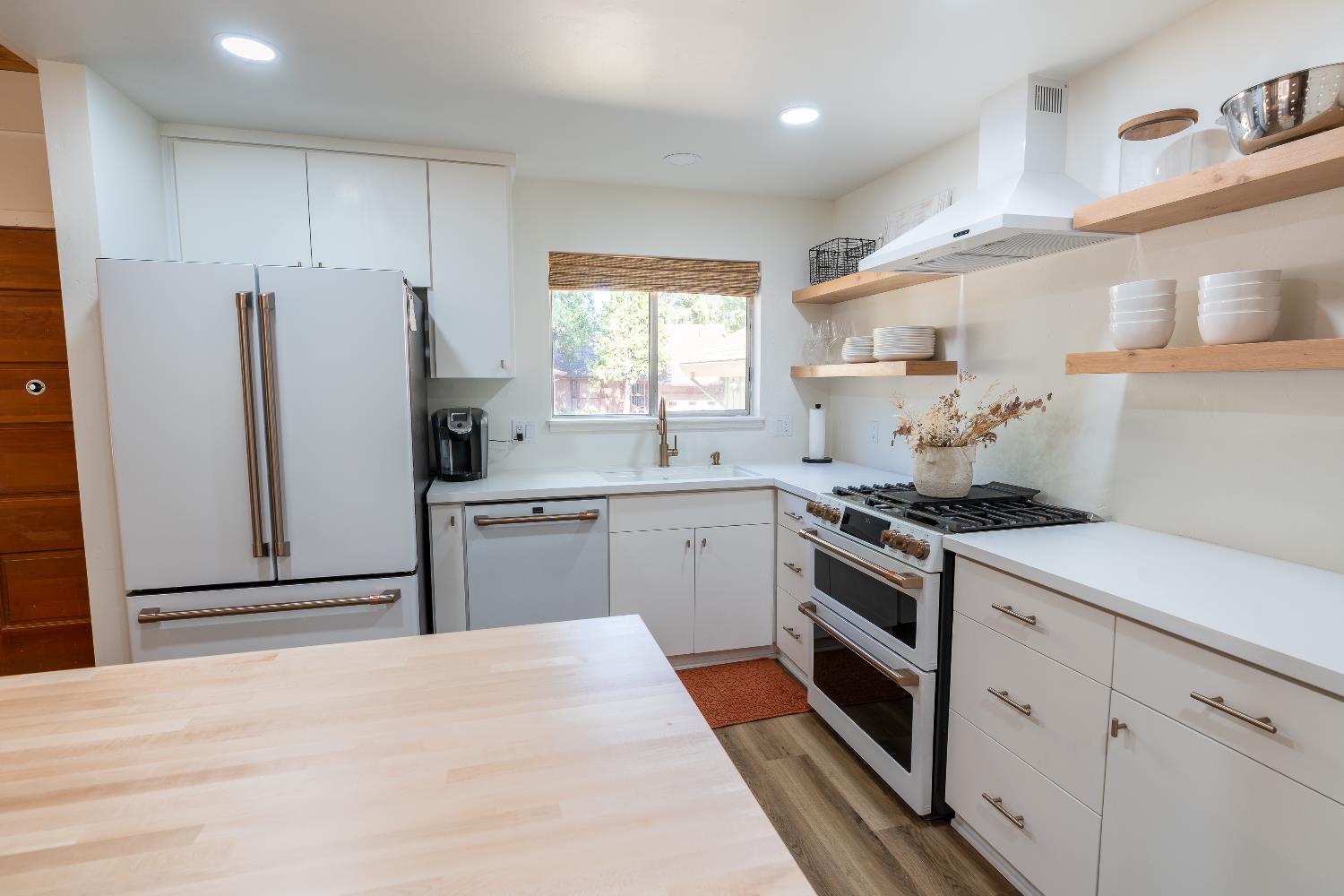 28960 Snowhite Ridge Drive Long Barn, CA 95335 - Photo 7 of 15 a kitchen with a stove a sink and a refrigerator
