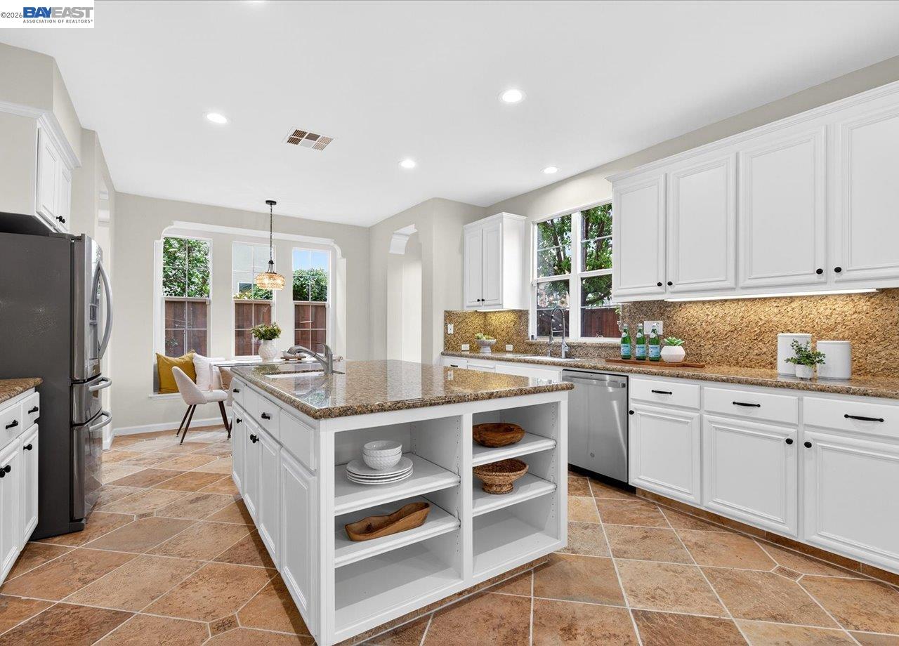 8148 Briar Oaks Drive San Ramon, CA 94582 - Photo 15 of 40 a kitchen with stainless steel appliances granite countertop a stove and a sink