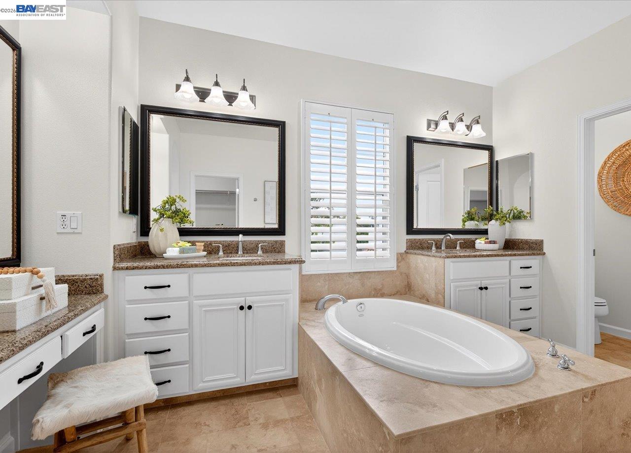 8148 Briar Oaks Drive San Ramon, CA 94582 - Photo 28 of 40 a bathroom with a double vanity sink mirror and bathtub