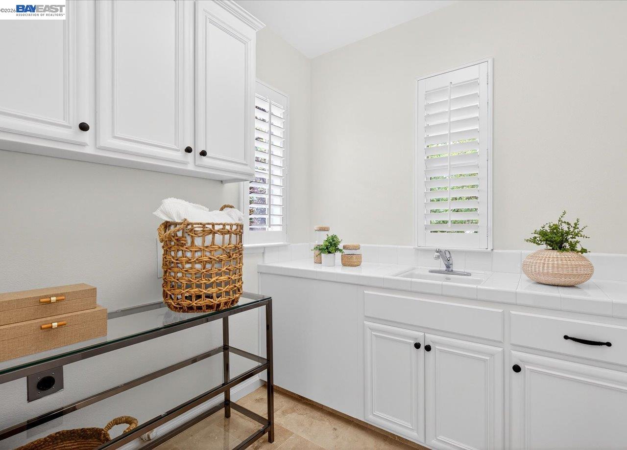 8148 Briar Oaks Drive San Ramon, CA 94582 - Photo 35 of 40 a view of cabinets a sink and a window