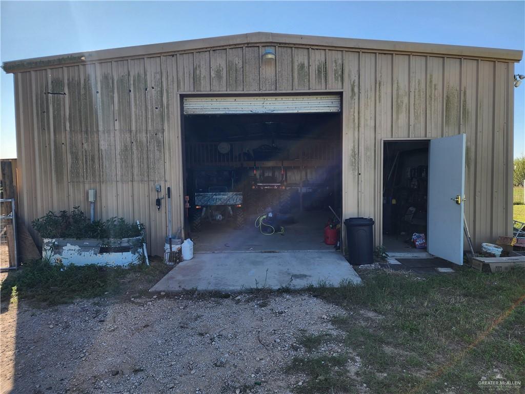8569 Charles Green Road Edcouch, TX 78538 - Photo 13 of 22 a view of a patio with table and chairs in front of house