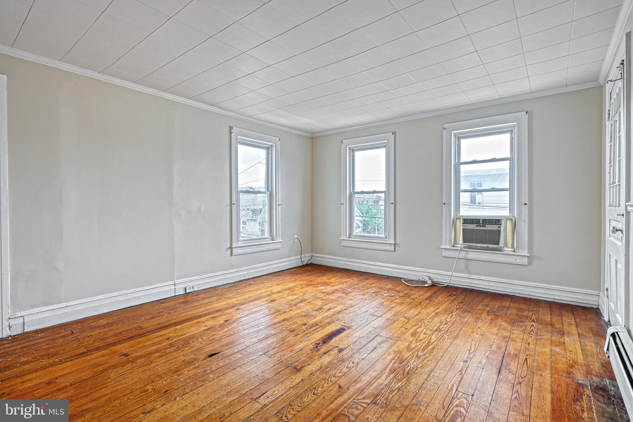 3 North Water Street Spring Grove, PA 17362 - Photo 26 of 52 a view of empty room with wooden floor and fan