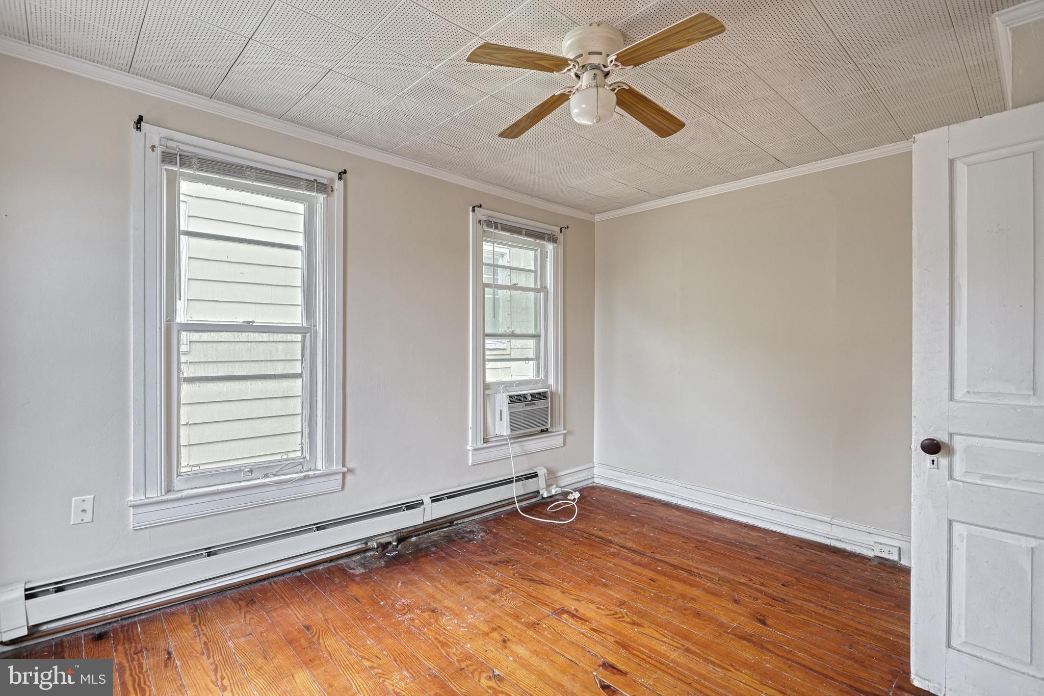 3 North Water Street Spring Grove, PA 17362 - Photo 28 of 52 a view of an empty room with a window and wooden floor