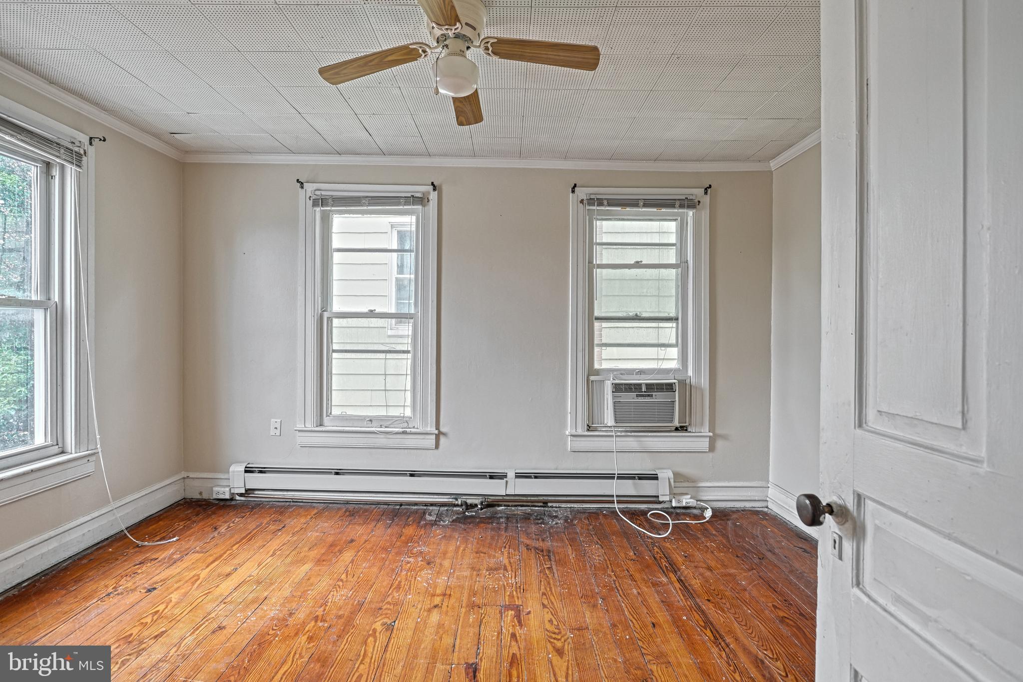 3 North Water Street Spring Grove, PA 17362 - Photo 29 of 52 an empty room with wooden floor and windows