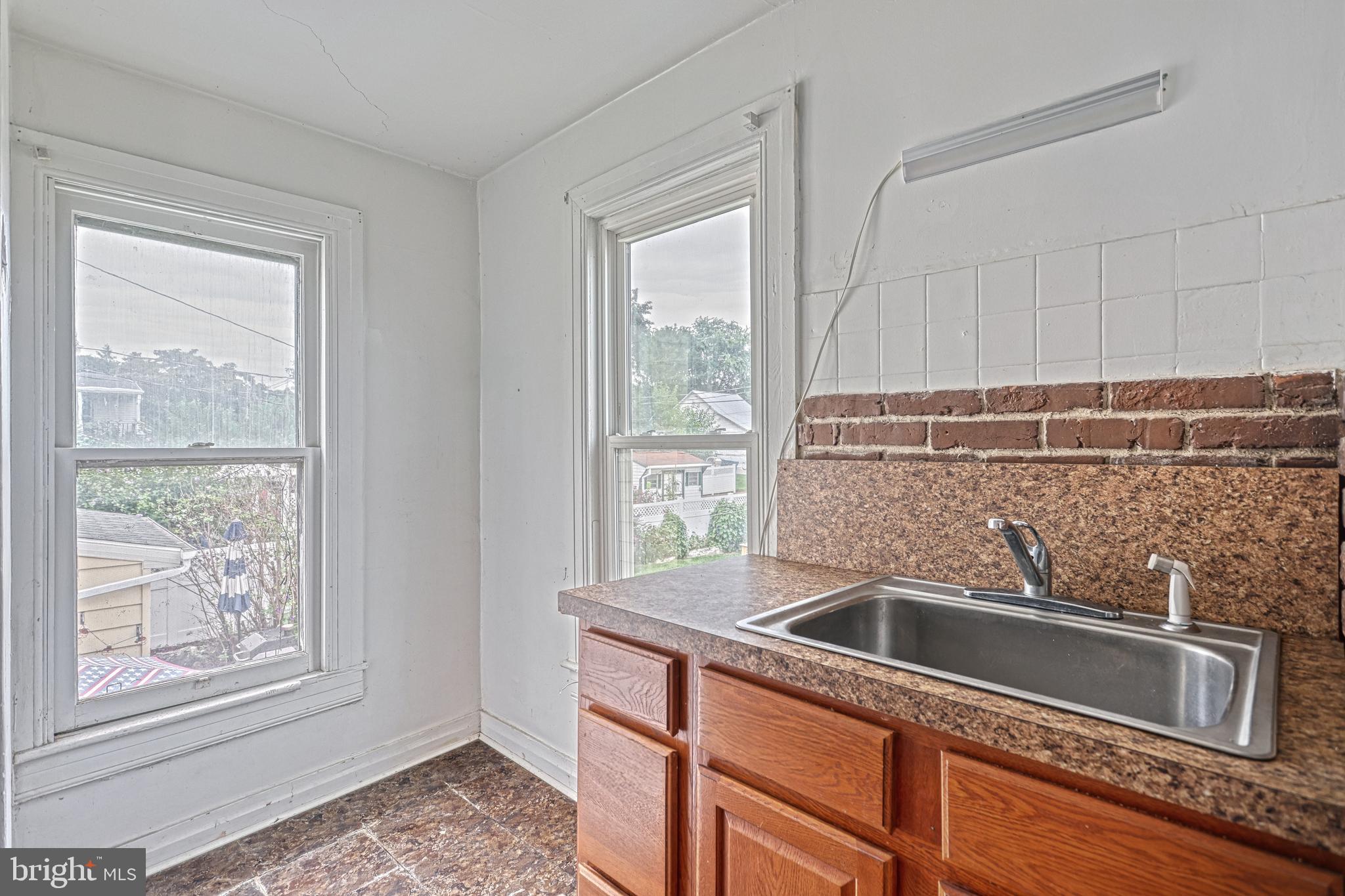 3 North Water Street Spring Grove, PA 17362 - Photo 34 of 52 a kitchen with granite countertop a sink and a window