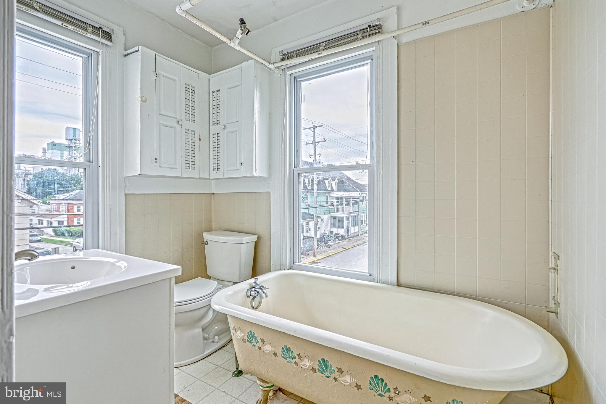 3 North Water Street Spring Grove, PA 17362 - Photo 38 of 52 a bathroom with a tub a sink and a window