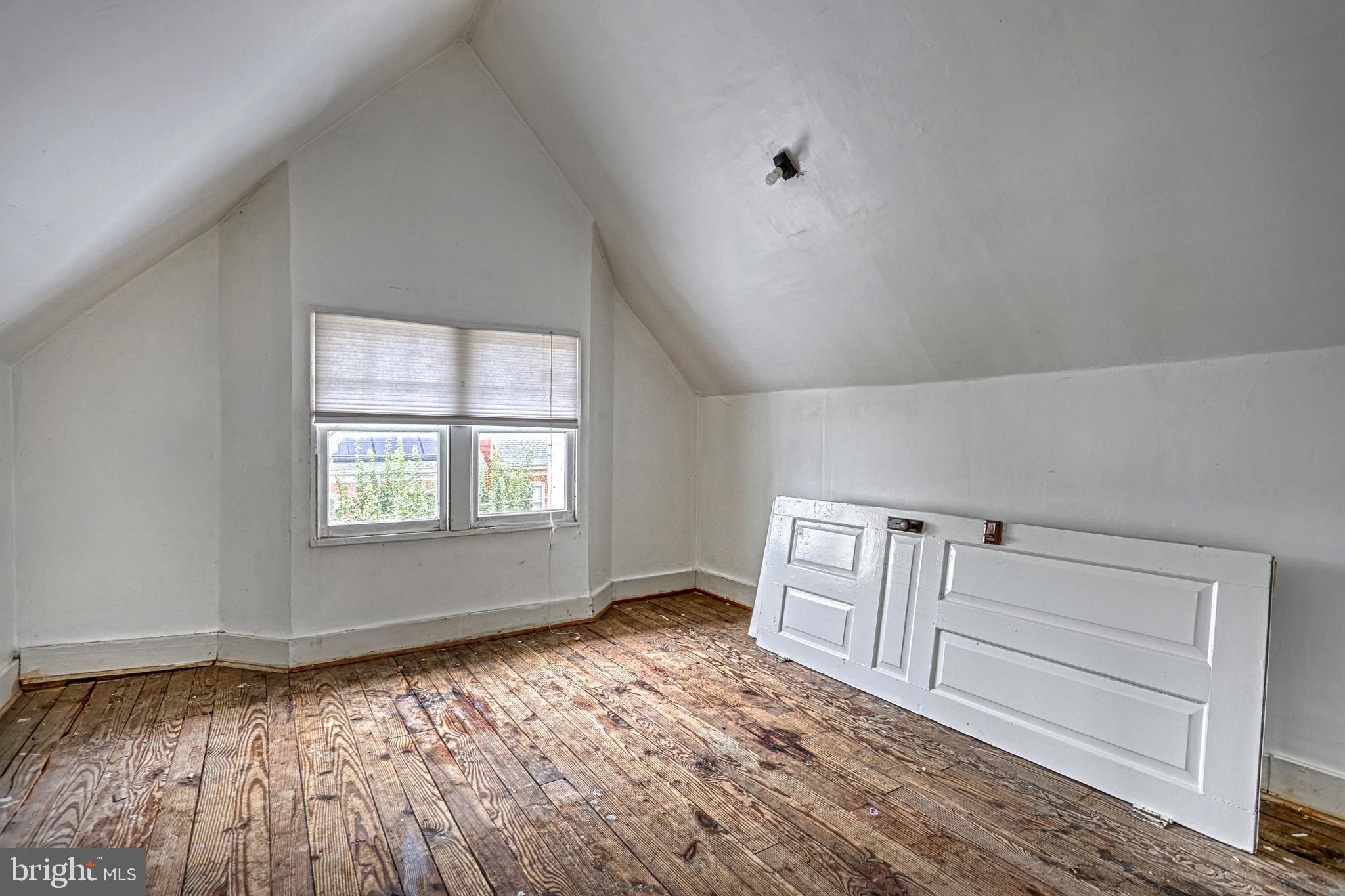 3 North Water Street Spring Grove, PA 17362 - Photo 44 of 52 an empty room with wooden floor and windows