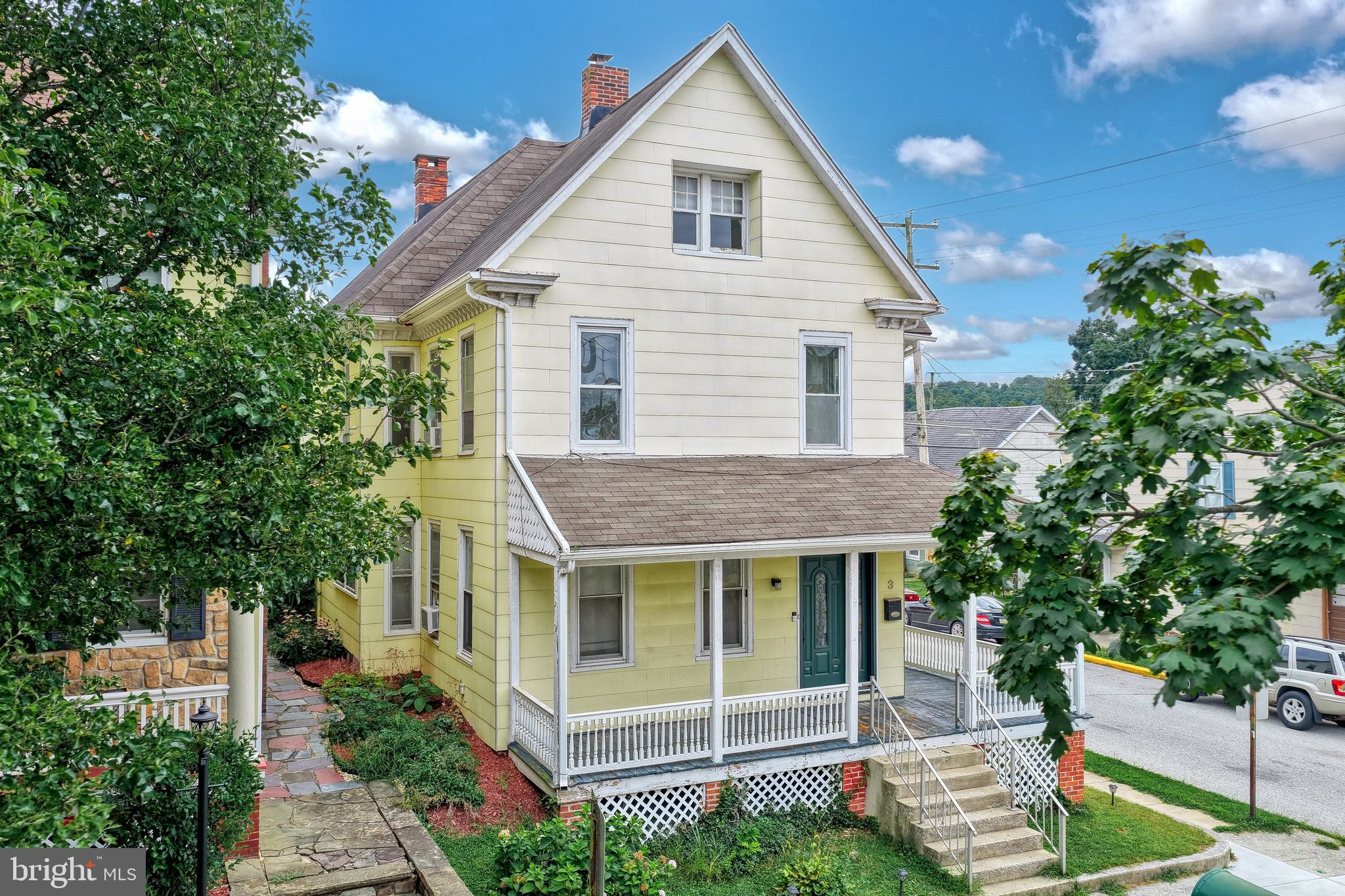3 North Water Street Spring Grove, PA 17362 - Photo 5 of 52 a view of a house with potted plants and a tree
