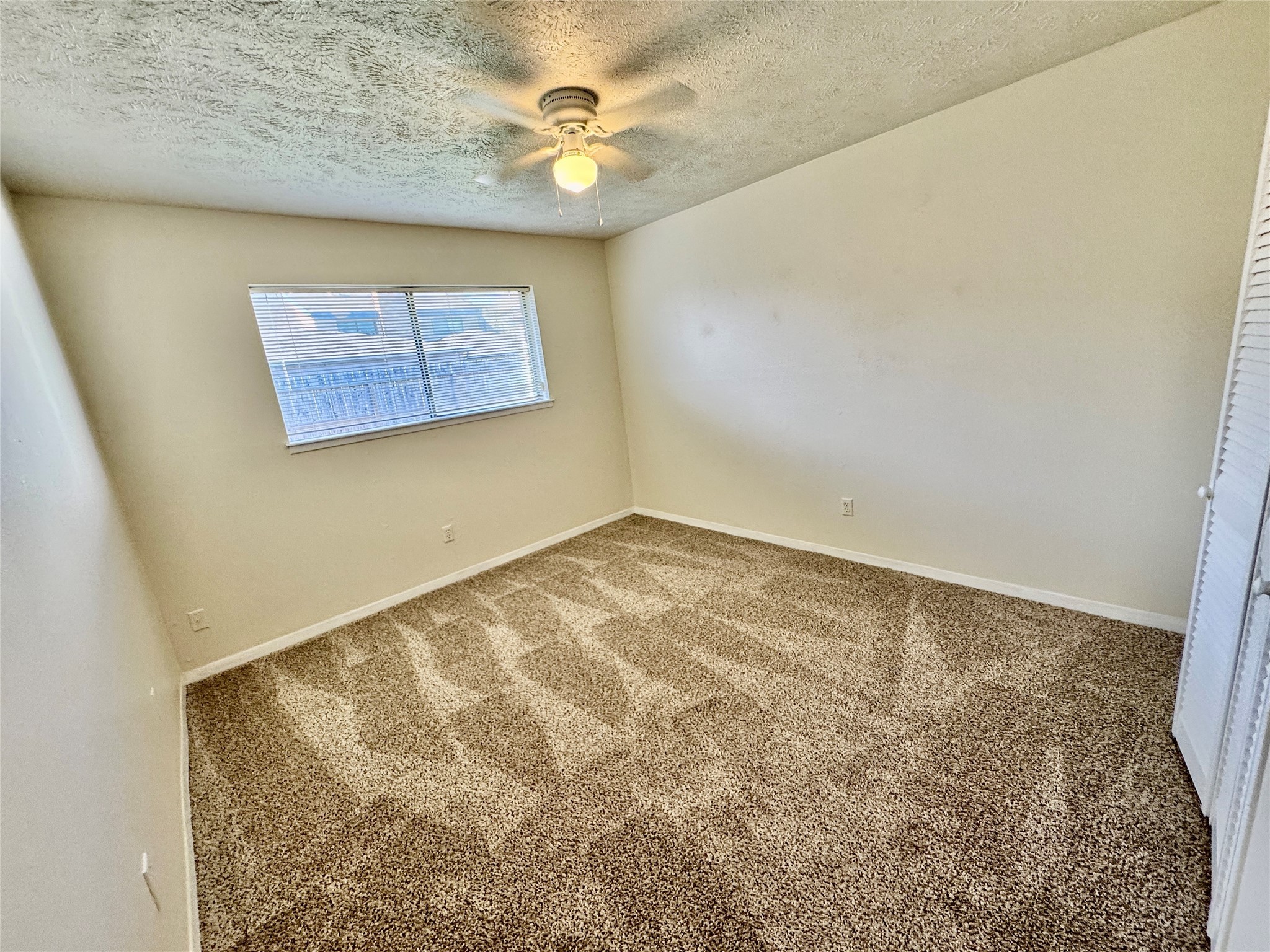 10131 Sagedale Drive Houston, TX 77089 - Photo 16 of 21 an empty room with a window
