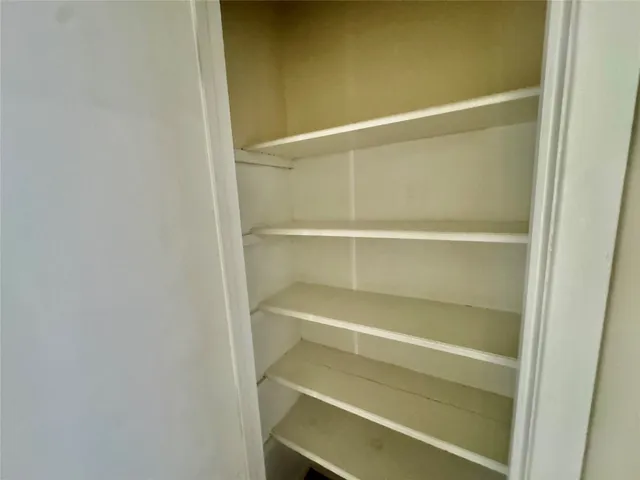 a empty closet with white paint