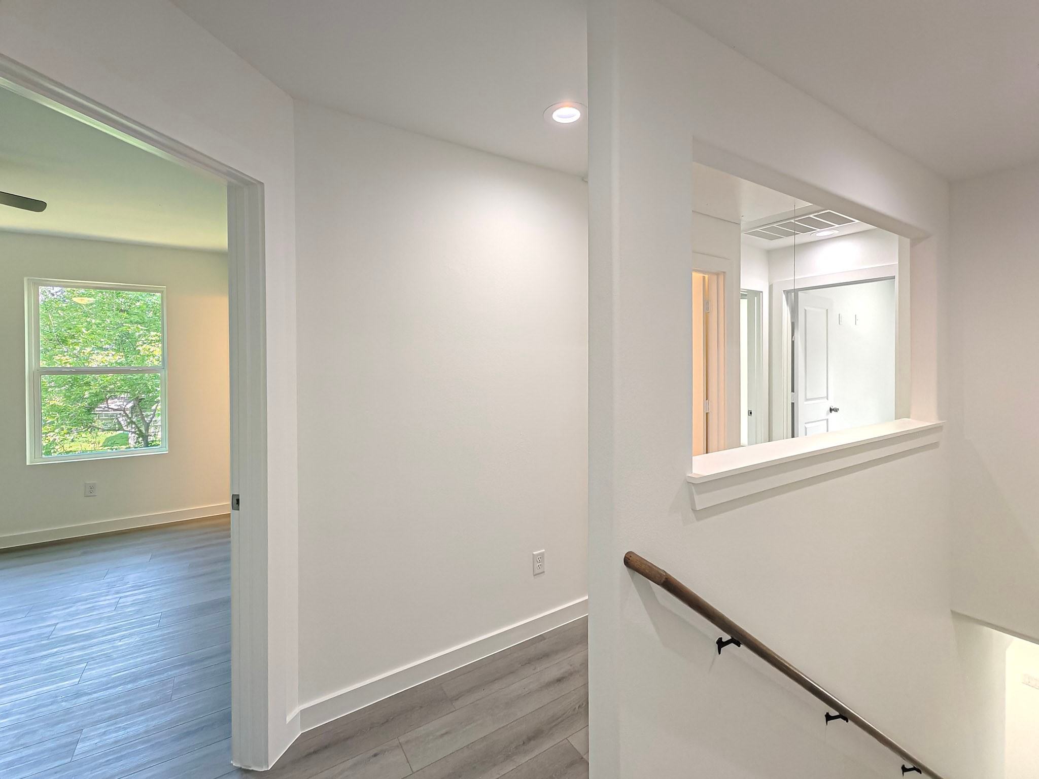 8617 Hoffman Street, Unit B Houston, TX 77016 - Photo 12 of 13 an empty room with wooden floor and windows