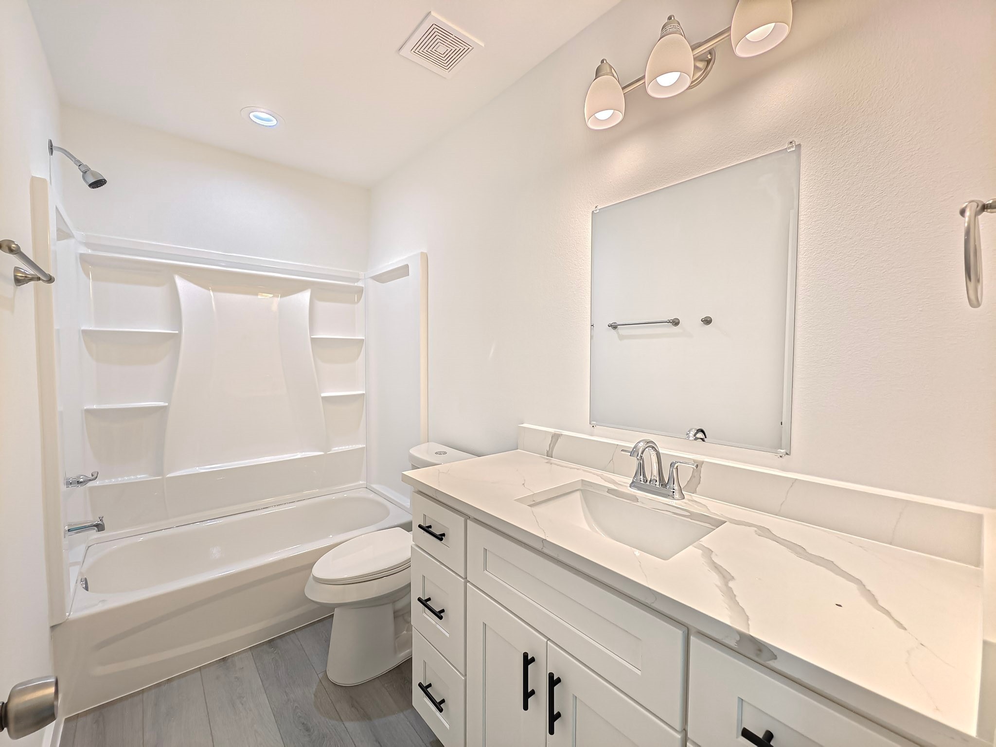 8617 Hoffman Street, Unit B Houston, TX 77016 - Photo 6 of 13 a bathroom with a granite countertop sink a toilet and shower