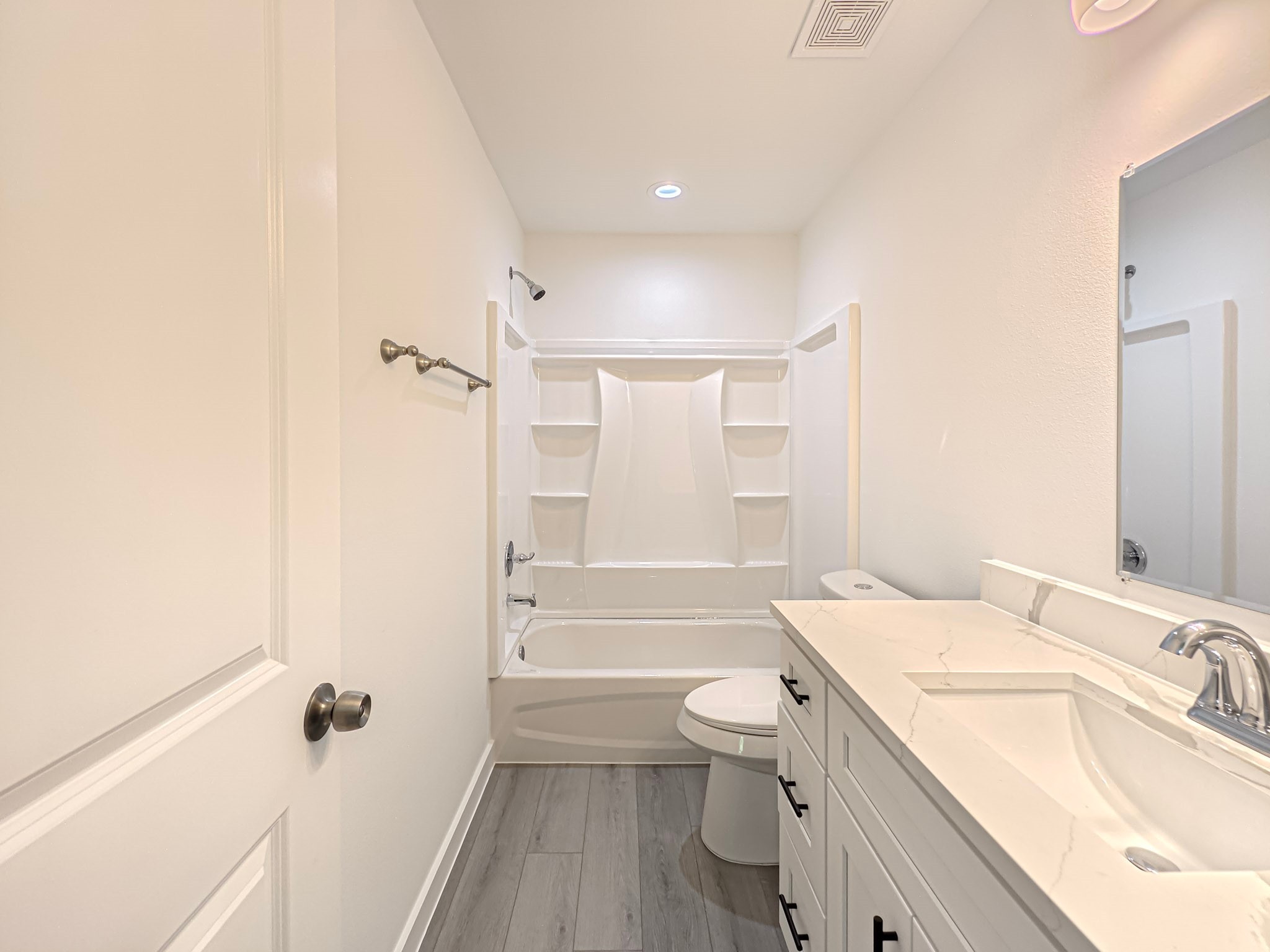 8617 Hoffman Street, Unit B Houston, TX 77016 - Photo 8 of 13 a bathroom with a granite countertop sink a toilet and shower